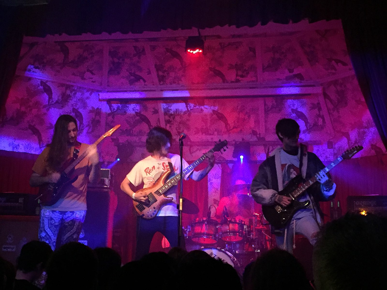 Polyphia performing live in 2019, showcasing their unique blend of math rock with intricate guitar work and dynamic stage presence