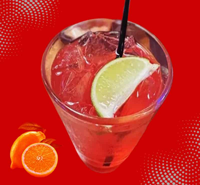 Ingredients to make Texas Roadhouse drink including lemons, blackberries, vodka and fruit syrups