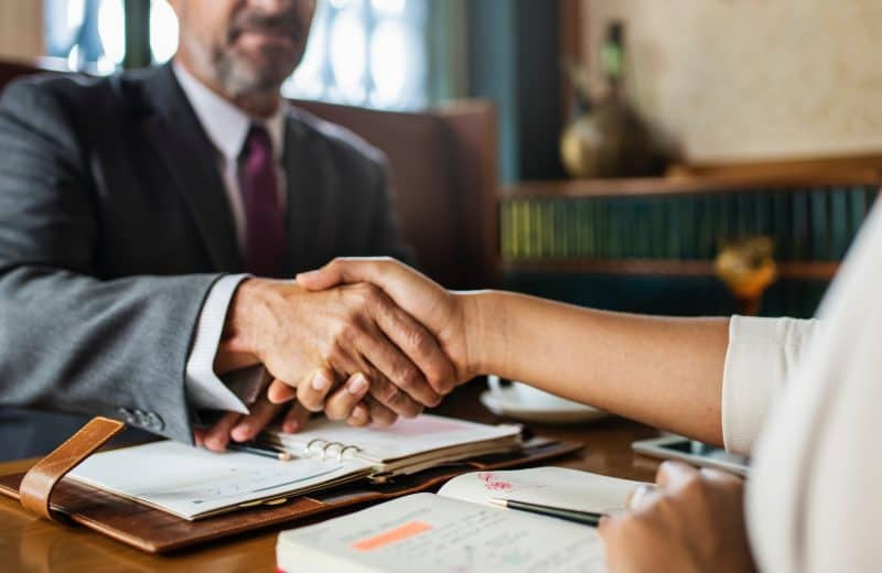 Shaking hands during music deal