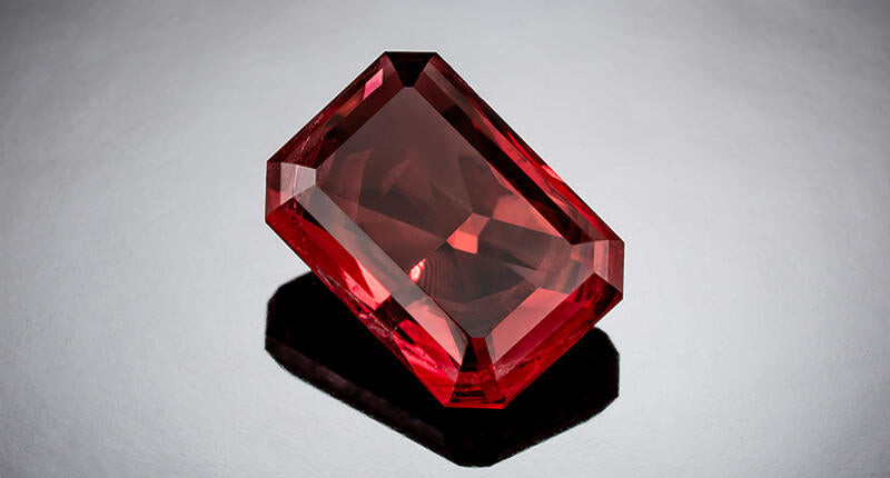 Red Beryl gemstone, showcasing its rare and vibrant red hue, found only in specific locations such as Utah and New Mexico.