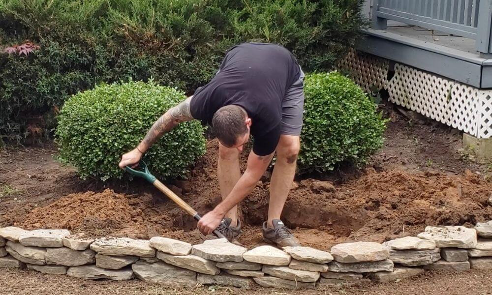 Dig the hole for the rock fountain base