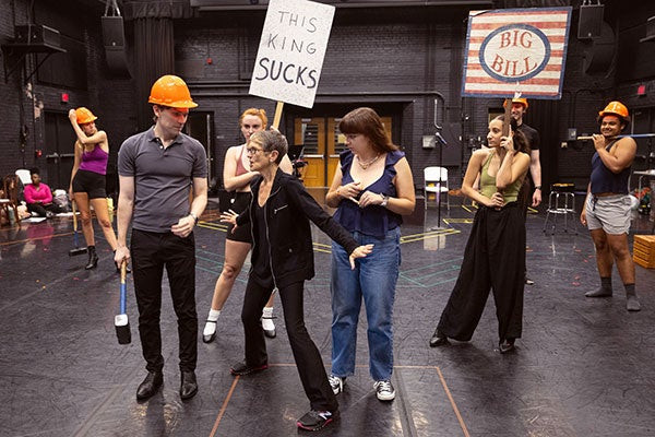 Actors in Rock of Ages listening to the director