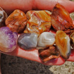 Agates and amethyst in hand