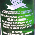 Rolling Rock beer bottle with classic green label