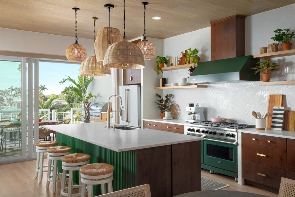 A beautifully renovated kitchen with an open floor plan, designed for Rock the Block, featuring a tropical theme.