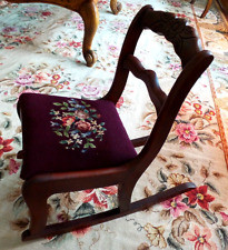 A selection of A.H. Schram rockers available at an antique show, illustrating the variety of styles and conditions you might encounter.