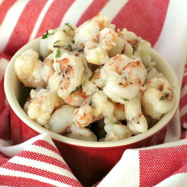 Sizzling rock shrimp sauteed to perfection, showcasing their vibrant pink hue.
