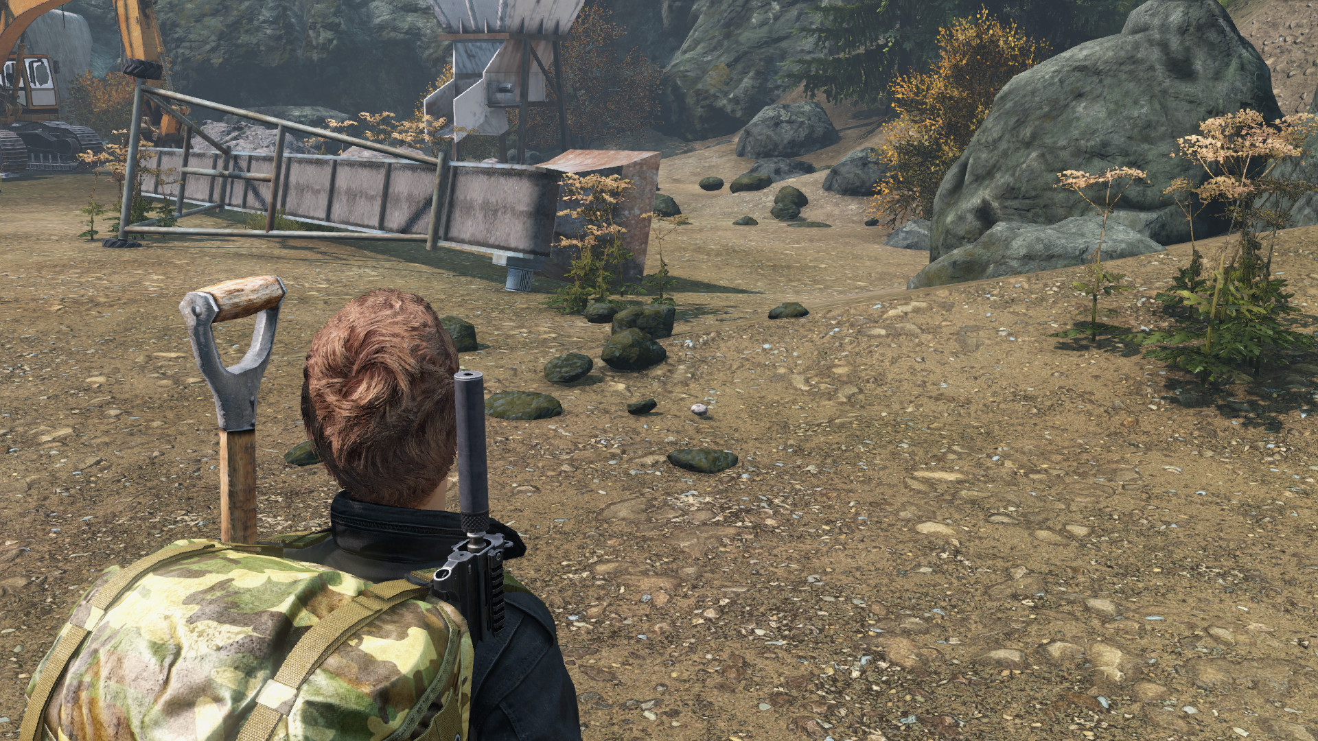 Close-up of small stones on the ground, ready to be picked up for crafting in DayZ