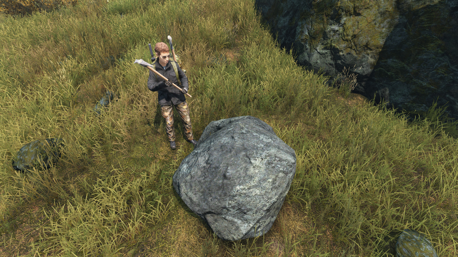 Equipping a pickaxe to mine a boulder, essential for gathering resources in DayZ