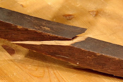 Close-up of split rocking chair runner showing wood grain