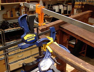 Clamps holding glued rocking chair runner