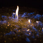 Fire pit filled with blue fire glass