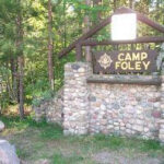 Camp Foley Sign with Trees