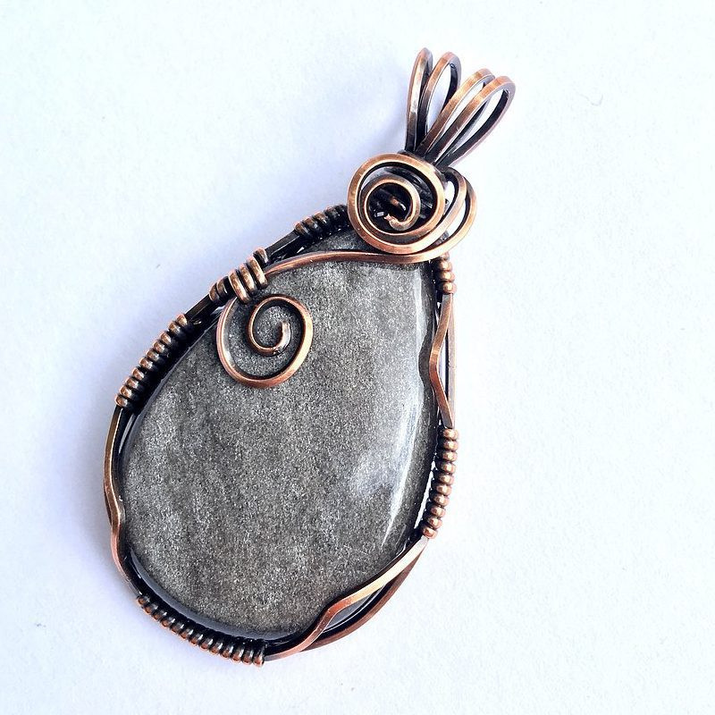 Teardrop pendant crafted from silver sheen obsidian