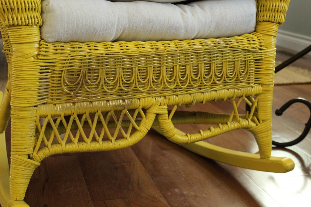 Damaged wicker requiring repair on a rocking chair
