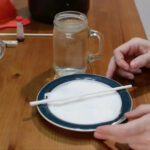 white stick covered in sugar on a plate