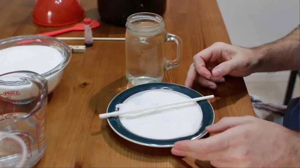 white stick covered in sugar on a plate