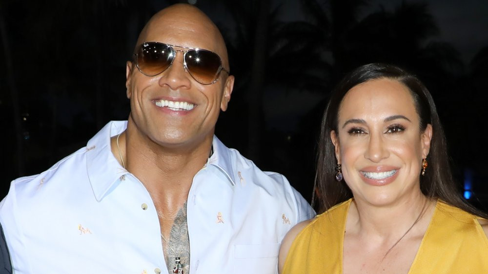 Dwayne Johnson and Dany Garcia smiling and posing for a photo, representing their past marriage