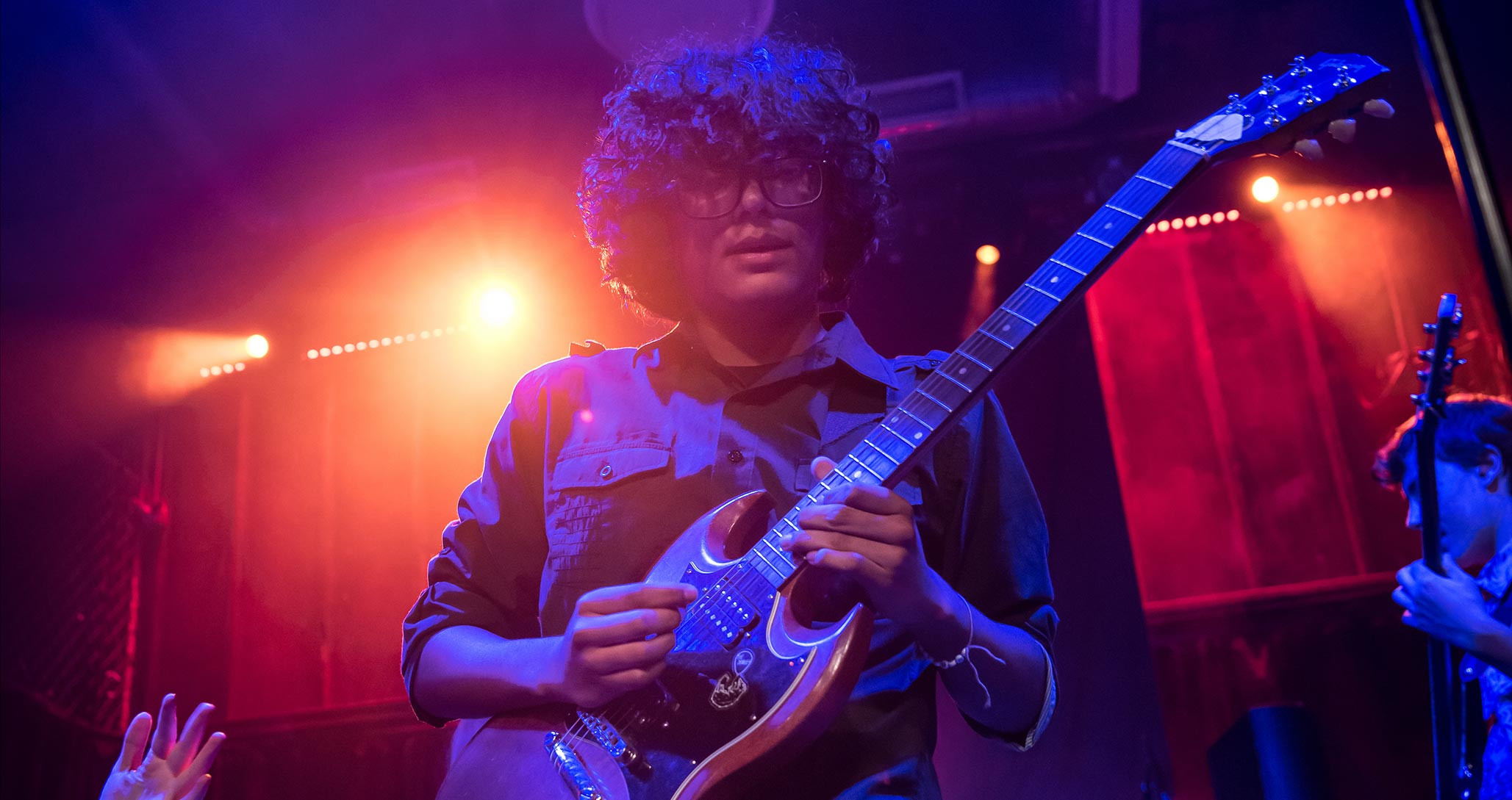 Jimi Hendrix performing on stage, showcasing his innovative and groundbreaking guitar techniques