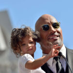 Dwayne Johnson with his daughter Jasmine, emphasizing the importance of family support
