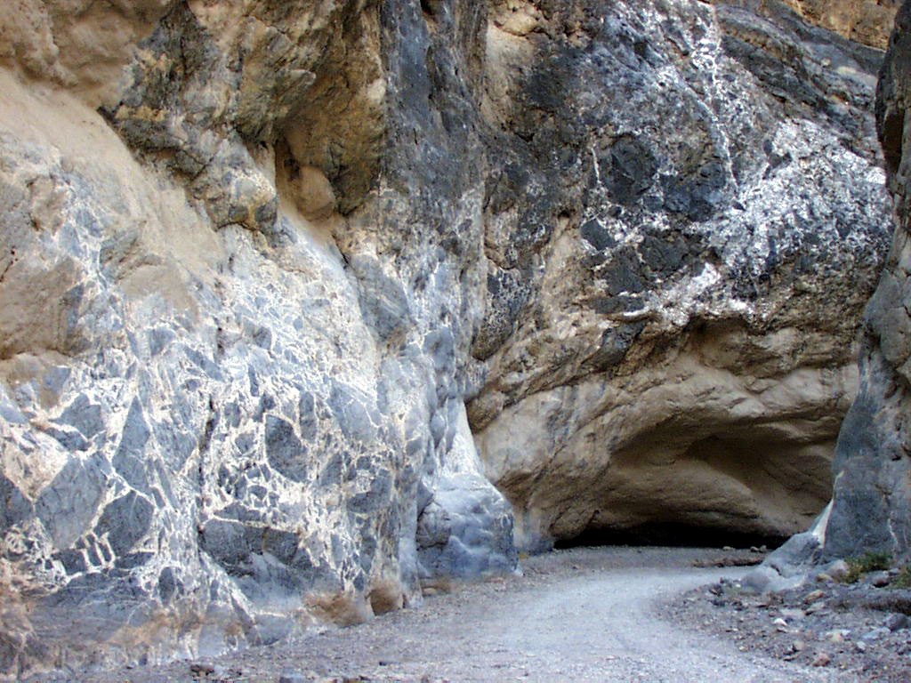 Grey rock consisting of a larger rock where the angular edges have broken off