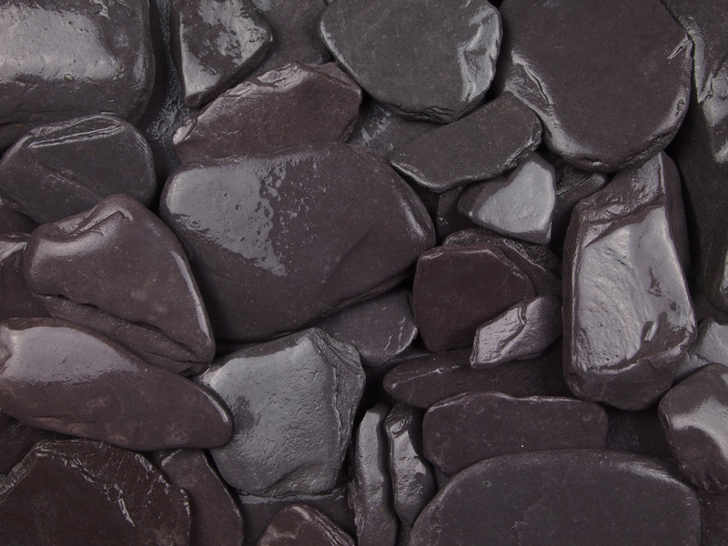 Close-up of tumbled blue paddlestones for pond edging