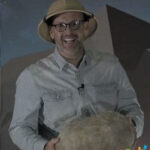 Cardboard box being transformed into a paper mache rock