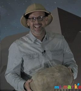 Cardboard box being transformed into a paper mache rock