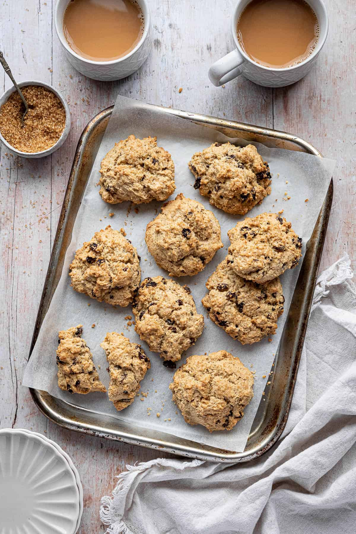 A close-up view showcasing the ingredients for rock cakes, including flour, butter, sugar, and dried fruits.
