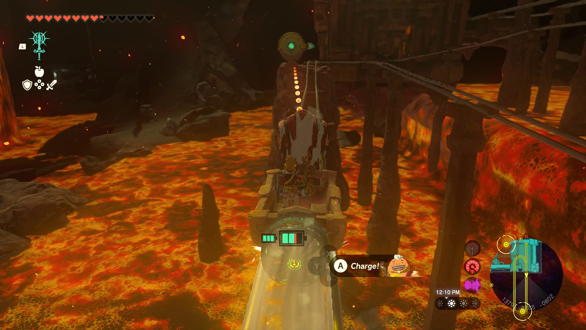 Link rides a minecart forward, pointing Yunobo, who is rolling in a ball, at a circular device in front in Tears of the Kingdom