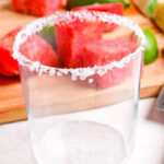 Empty margarita glass with salt rim