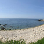 A panoramic photo of Watershoot Bay, a rocky beach on the Isle of Wight