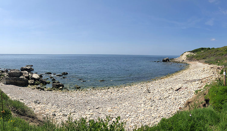 A panoramic photo of Watershoot Bay, a rocky beach on the Isle of Wight