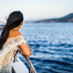 Woman looking out to sea on a cruise ship