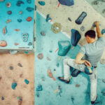 Young man practicing bouldering in indoor climbing gym